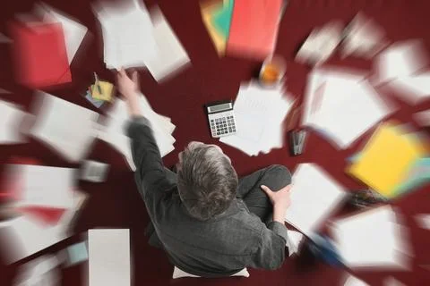 Accounting and processing a mess of paperwork Foto stock