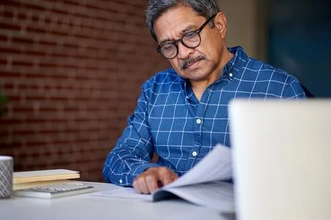 Accounting, document and man in office with review, tax check or evaluation of Stock Photos