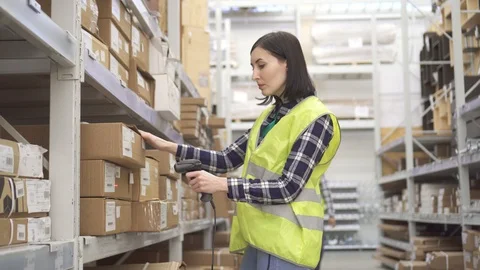 Accounting of goods in the warehouse with barcode scanner Stock Footage 100876931