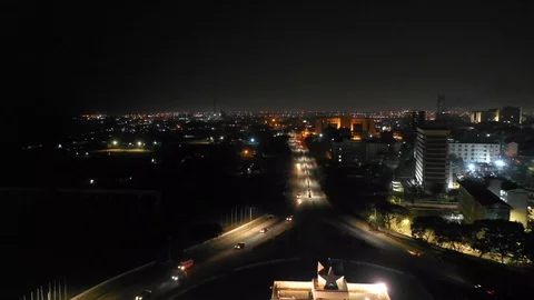 Accra, Black Star Gate round about by night- drone view, zoom out Stock-Footage 127641203