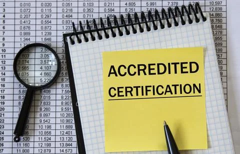 ACCREDITED CERTIFICATION - words in a white notebook on the background of a t Stock Photos
