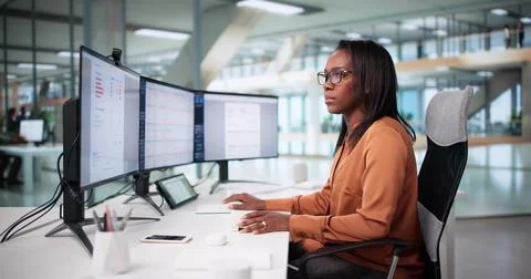 Accurate Billing Manager Audits Payroll Codes Using Software Professionally. Stock Photos