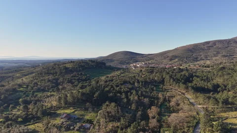 Acebo Spanish Village Aerial Pullback Over Rural Farmland and Olive Hills Stock Footage 335373629