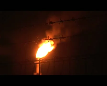 Aceh burning fire of gas chimney at night Stock Footage 11518273