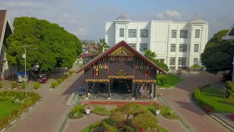 Acehnese house style - drone point of view medium long shot Stock Footage 113856619
