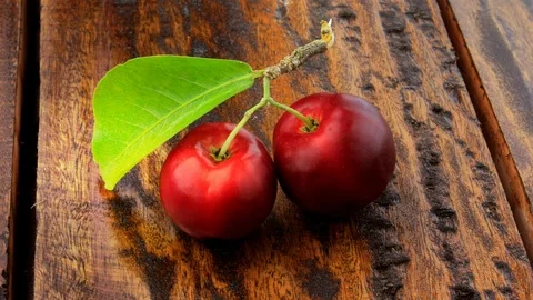 Acerola Cherry raw, fresh, on rustic wooden table, High vitamin C and antioxi Stock Footage 104581374