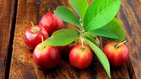 Acerola Cherry raw, fresh, on rustic wooden table, High vitamin C and antioxi Stock Footage 104581481