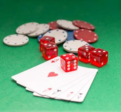 Aces chips cubes on a green background Foto stock