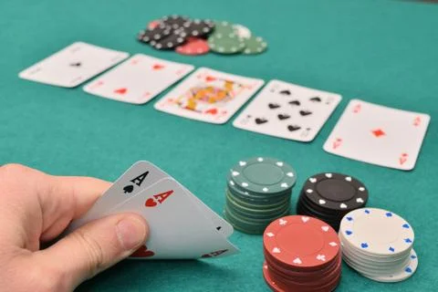 Aces pair on a gambling table with chips Stock-Fotos