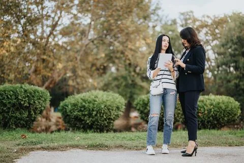 Achieve Goals Through Collaborative Learning with Friends in a Sunny Park Stock Photos