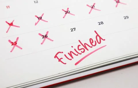 Achieving project completion and marking successful deadlines on a calendar.. Stock Photos