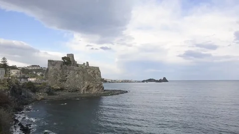 Aci Castello castle, Sicily with acitrezza background Stock Footage 73302287