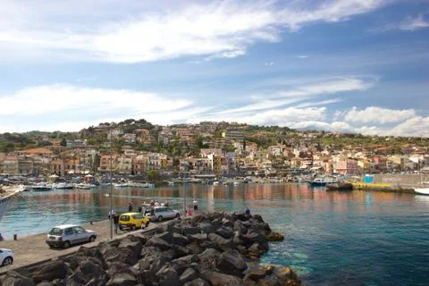 Aci Trezza Sicily, view of the famous town from the harbor with wonderful sea Stock Photos