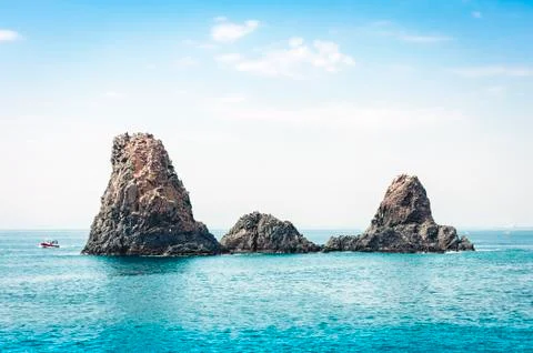 Acitrezza rocks of the Cyclops, sea stacks in Catania, Sicily, Italy. Stock Photos