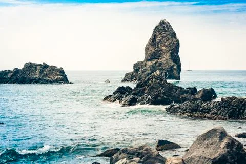 Acitrezza rocks of the Cyclops, sea stacks in Catania, Sicily, Italy. Stock Photos