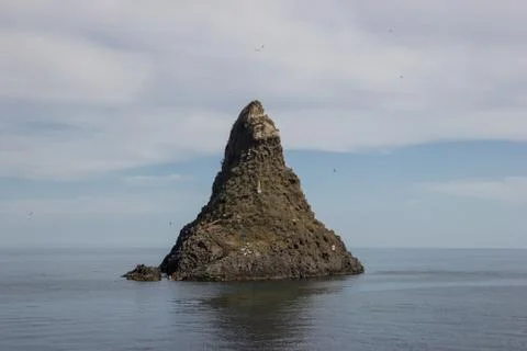 Acitrezza Sicily view of one of the cyclopean islands, scenic view of sea and 스톡 사진