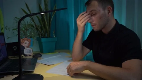 Acne guy at the desk thinks what to wish, make, order in a letter Stock Footage 121641725