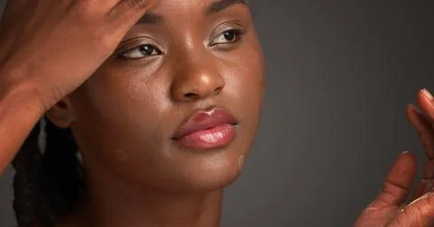 Acne patch, lip gloss and skincare with black woman on studio space for cos.. Stock Photos