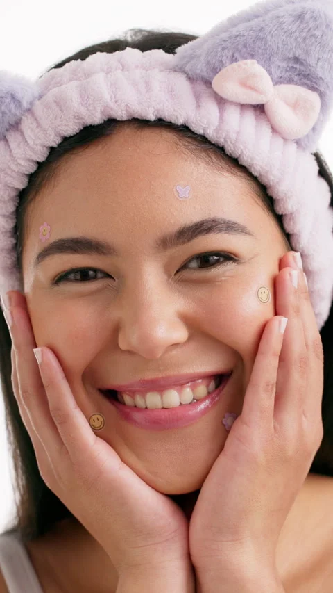 Acne patch, skincare and face of woman in studio for self care, cosmetics and Video stock 333701641