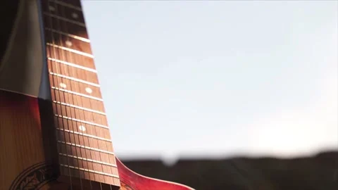 Acoustic guitar body close-up, strings, bridge, resonator hole Stock Footage 206384480