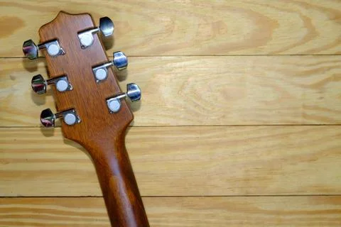 Acoustic guitar head on wood background Stock Photos