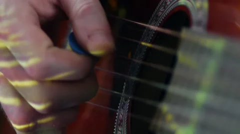 An acoustic guitar in the light Stock-Footage 20430430