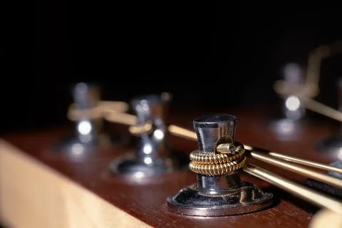 Acoustic guitar peg and string macro photography close up texture view finger Stock Photos