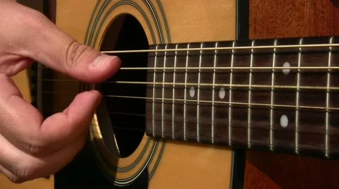 Acoustic guitar playing Stock Footage