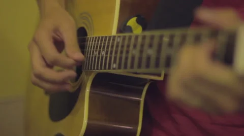 Acoustic guitar playing Stock Footage 33828639