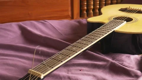 Acoustic guitar on the sofa 動画素材 141995109