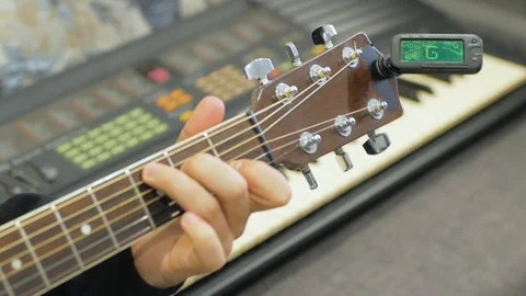 Acoustic guitar tuning Stock Footage 103807598