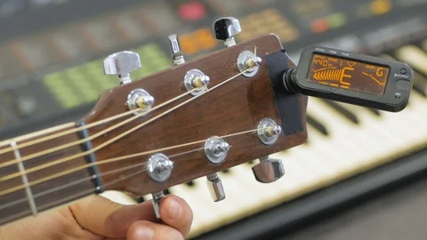 Acoustic guitar tuning Stock Footage 103807622