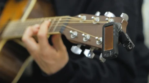 Acoustic guitar tuning Stock Footage 103807752