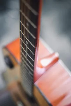 Acoustic Guitar with very shallow depth of field, focus on strings. Interes.. Stock Photos