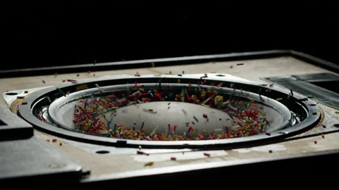 Acoustic sound system close-up, flying confetti sweets. Loud music volume macro Stock Footage 169117387