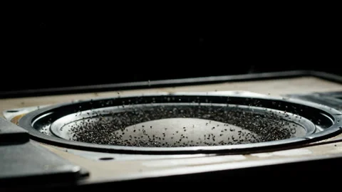Acoustic sound system close-up, flying spices. Loud music volume macro shooting Stock Footage 169117448