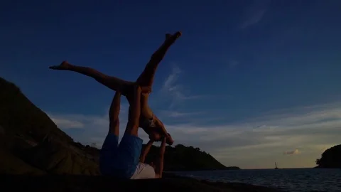 Acro Yoga at sunset on the beach. Stock Footage 82188354