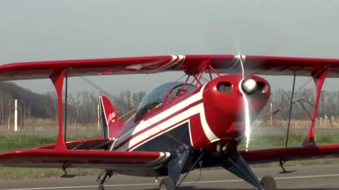 Acrobaster PS-2B is moving along taxiway towards parking lot. Krasnodar. Stock Footage 139398060