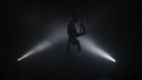 Acrobat in a Hoop Hanging Upside Down Vídeo Stock 259874068