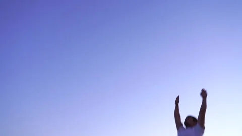 Acrobat jumping on a trampoline. back flip Stock Footage 155296674