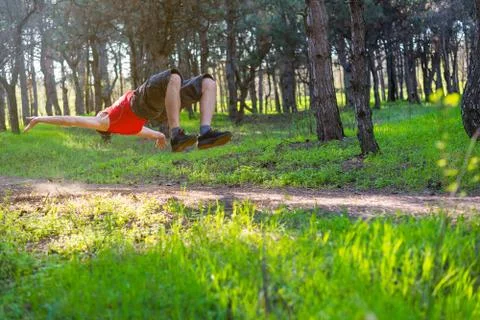 Acrobat man practicing outdoor space. Stock Photos