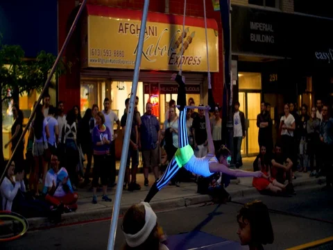 Acrobat performs on ropes at Ottawa 2017 Glowfair. Stock Footage 76768701