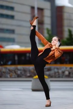 Acrobat using the phone in the city Stock Photos