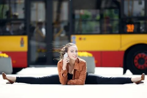 Acrobat using the phone in the city Stock Photos