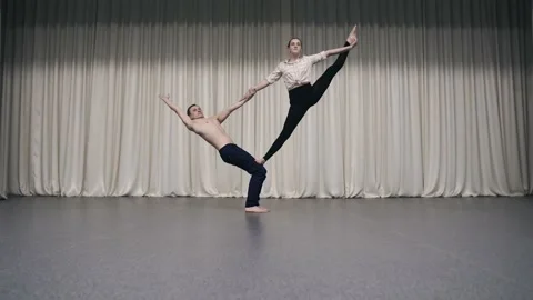 An acrobatic duo rehearses on stage Stock Footage 150433078