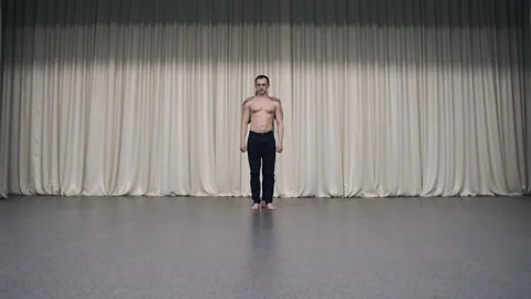 An acrobatic duo rehearses on stage Stock Footage 150433111