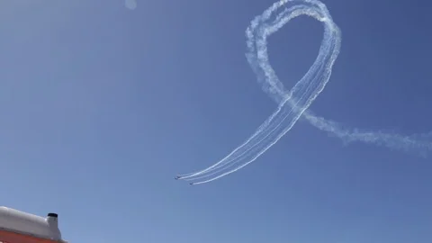 Acrobatic figure of a plane during an Air Show by the beach (take 2) Video stock 88390726