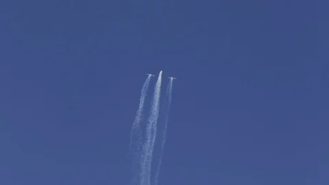 Acrobatic figure of a plane during an Air Show by the beach - long take Stock Footage 88403171