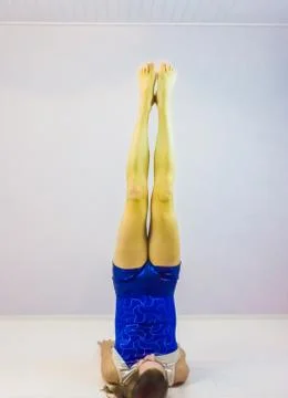 Acrobatic gymnastics the candlestick exercise preformed by a young transgende Stock Photos