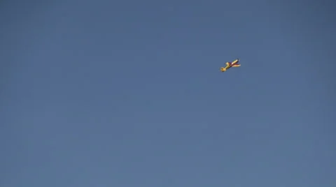 Acrobatic maneuvers, plane drawing on a blue sky, white trail, air show Stock Footage 40494100